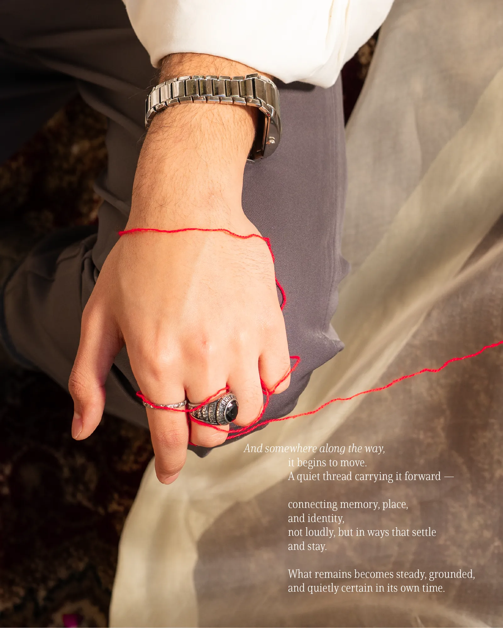 Reference detail: the hand and the red thread.